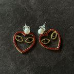 Aretes de corazón con ojos