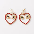 Aretes de corazón con ojos